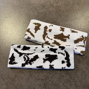 Knitted cow print headbands in brown and black patterns for sports and outdoor leisure