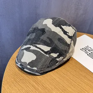 Detail of vintage camouflage ivy cap with black and grey pattern and sturdy canvas texture