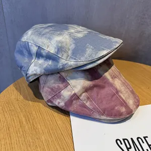 Vintage tie-dye flat caps for women in blue and burgundy with a breathable cotton texture