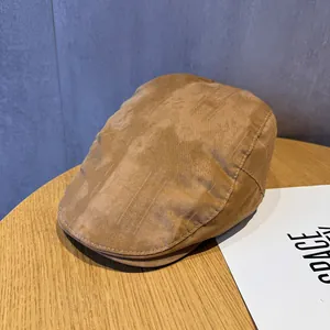 Close-up of caramel retro newsboy cap with premium suede texture and stitching detail