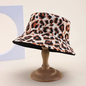 Classic leopard print reversible bucket hat for outdoor sun protection on display