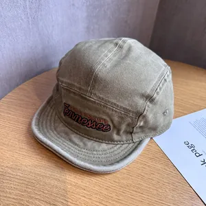 Detail of vintage washed khaki camper hat featuring Tennessee embroidery on cotton twill