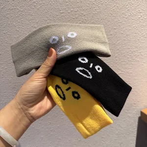 Lot de trois bandeaux de sport tricotés avec broderie emoji en gris noir et jaune
