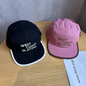 Retro 5-panel baseball hats in black and pink with West Coast Skating 3D embroidery