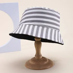 Detail of grey striped bucket hat showing textured pattern and inner black lining fabric