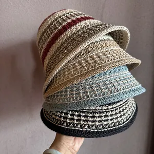 Stack of colorful crochet bucket hats showing breathable knit texture and diverse colorways