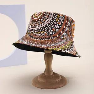 Retro Bohemian bucket hat with mandala patterns on a wooden display stand