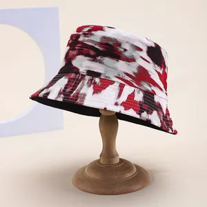 Modern tie-dye bucket hat with abstract red and black patterns for sun protection