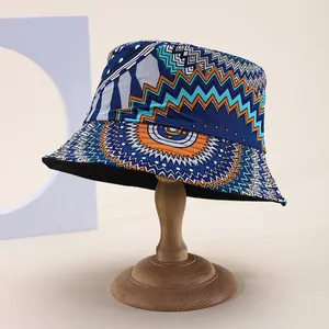 Detail of bohemian bucket hat with geometric tribal pattern and black lining on a stand