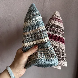 Handmade crochet pointed bucket hat in blue and reddish-brown striped knitted fabric