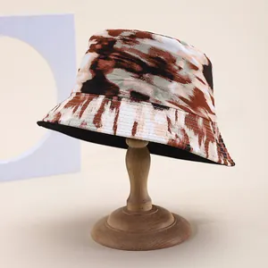 Tie-dye reversible bucket hat in brown and olive oil painting print for sun protection