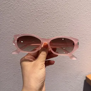 Detail view of pink translucent frames and gradient lenses with side temple measurements