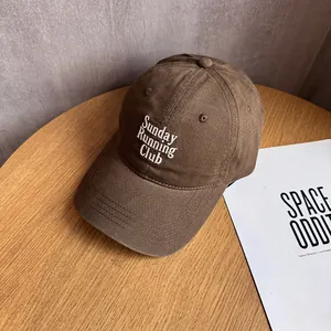 Close-up of Sunday Running Club embroidery on premium brown twill cotton baseball cap