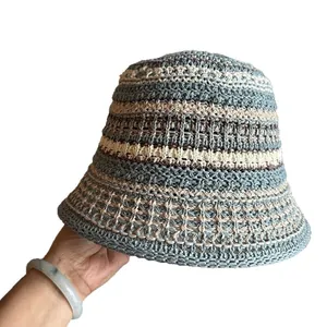 Handcrafted crochet bucket hat with colorful striped pattern shown on a white background
