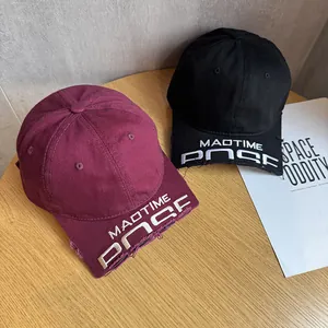 Vintage washed baseball caps in burgundy and black with distressed brim and 3D embroidery