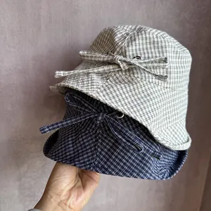 Women's plaid bucket hats with bow ties in navy and beige, sun protection headwear