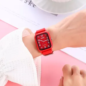Fashion women quartz watch with red square dial and silicone strap on a model wrist