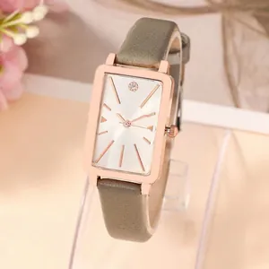 Elegant rectangular rose gold watch with grey leather strap and sunray dial for women