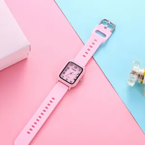 Close-up of a stylish pink square quartz watch with a silicone strap on a colorful background