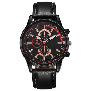Détail d'une montre à quartz pour homme avec bracelet cuir noir et lunette rouge élégante