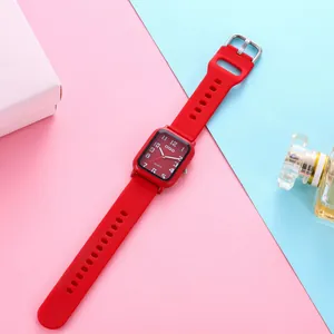 Detailed view of red square quartz watch featuring soft silicone strap and silver buckle