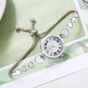 Women's silver heart link bracelet watch with rhinestone shell dial and adjustable strap
