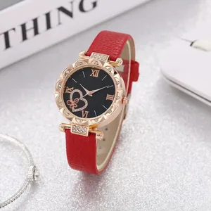 Women's rose gold watch with red leather strap, rhinestone bezel and heart-pattern dial