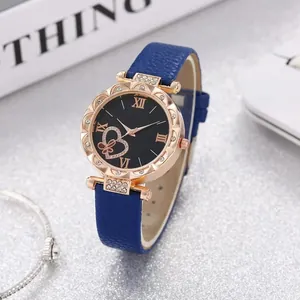 Elegant women's watch with heart-shaped dial and rose gold case on silver glitter base