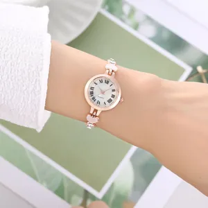 Elegant rose gold women's watch with heart charms and crystal-set slim strap
