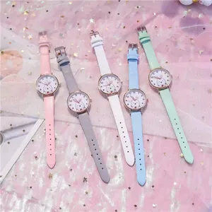 Detailed view of multiple colorful cartoon rabbit quartz watches with leather straps
