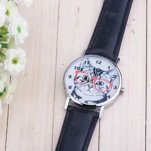 Close-up of a stylish cat pattern watch with black leather strap on a wooden surface