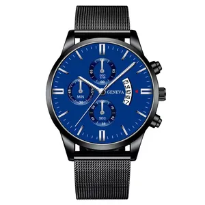 Detail of blue dial men's watch with mesh strap and date window in macro view