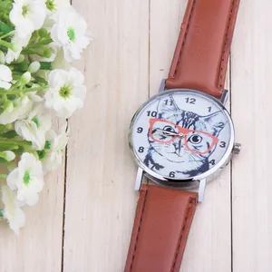 Close-up of a stylish quartz watch featuring a cute cat dial and brown leather strap