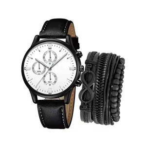 Detailansicht von minimalistischer schwarzer Herrenuhr und mehrlagigem Flechtarmband Set