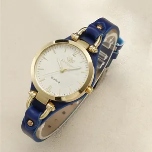 Detail of a women quartz watch with white sunray dial and blue leather strap horsebit buckle