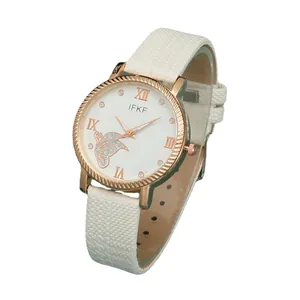 Women's rose gold quartz watch with white leather strap and butterfly dial design