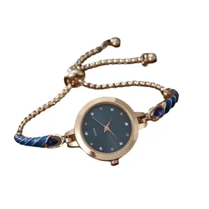 Elegant rose gold quartz watch for women with deep blue dial and adjustable bracelet