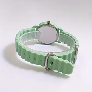 Mint green quartz watch with wavy silicone strap and minimalist round case