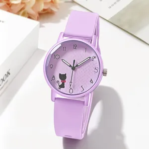 Macro view of purple quartz watch dial with cute cat pattern and silicone strap