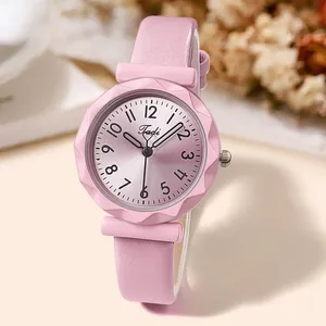Detail shot of the pink quartz watch with a faceted bezel and radial brushed dial texture