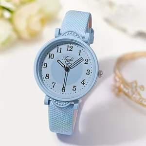 Detailed view of sky blue women's quartz watch with a small round dial and leather strap