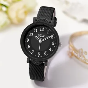 Detail view of Tadi quartz watch with black matte case and white Arabic numerals