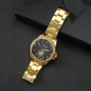 Rinnandy gold couple watch with black dial and star diamond accent on gift box