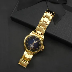Elegant gold quartz watch with deep blue dial and star detail in a luxury gift box