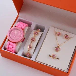 Women's quartz watch gift set with pink silicone strap and heart jewelry in orange box