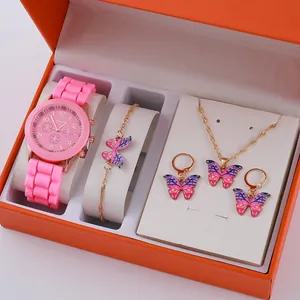 Women's pink quartz watch and gold butterfly jewelry set in a premium orange gift box