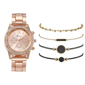 Coffret montre femme or rose élégant avec lunette strass et quatre bracelets assortis
