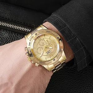 Luxurious gold-tone men's business watch with large dial and steel strap worn on wrist