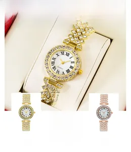 Close-up of three luxury crystal quartz watches in gold, silver and rose gold finishes