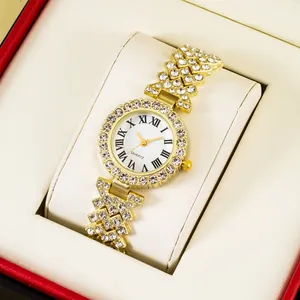 Detailed view of women's gold quartz watch with rhinestones in a premium red gift box